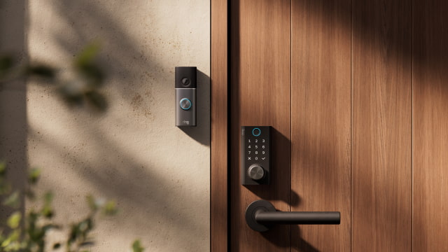Ring Smart Lock installed on a wooden door beside a Ring video doorbell.