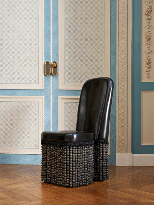 Padded Chair 1860 by Isabel Rower, with ceramic beads around the seat.