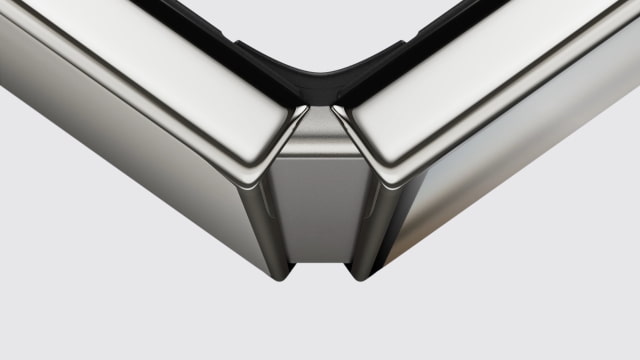 A close-up of the hinge and display edges on a partially folded iPhone Duo.