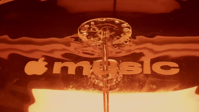 The physical rig used to vibrate liquid above the Apple Music wordmark