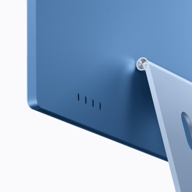 Four Thunderbolt 4 ports on the back of a blue M6 iMac.